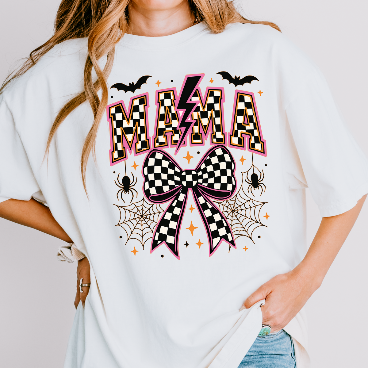 Mama Halloween Bow Shirt & Crewneck | Checkered Bow Halloween | Spooky Mama | Pink Halloween Graphic | Cute Fall Graphic | Unisex Tee & Crewneck